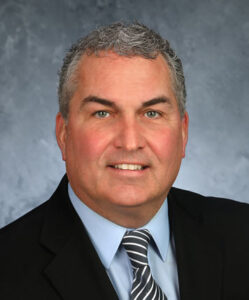 headshot of John Schumacher