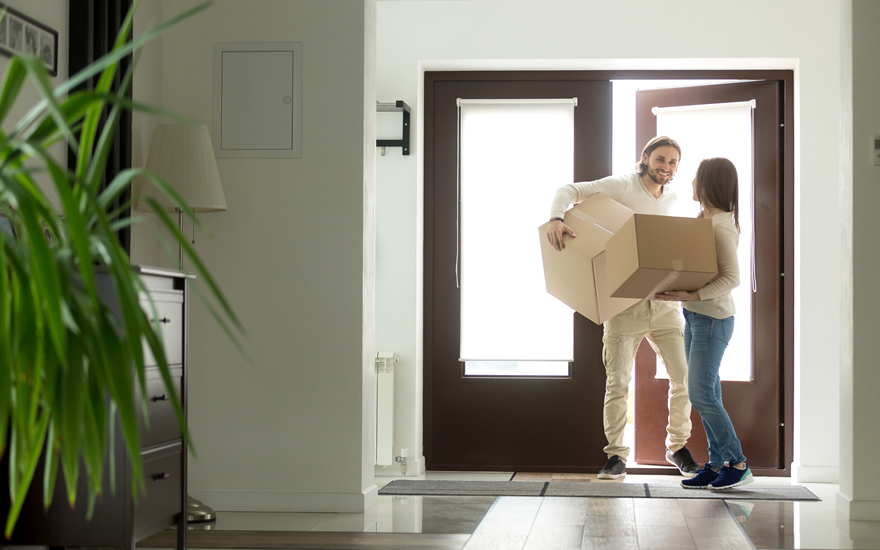 young couple moving into their new financed home